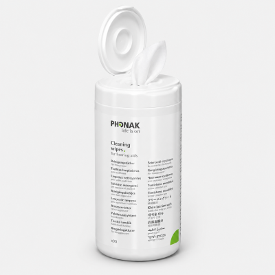 A white cylindrical Phonak Cleaning Wipes (dispenser) for hearing aids, shown with an open lid and a wipe protruding. The label displays multilingual text and the Phonak logo with the slogan